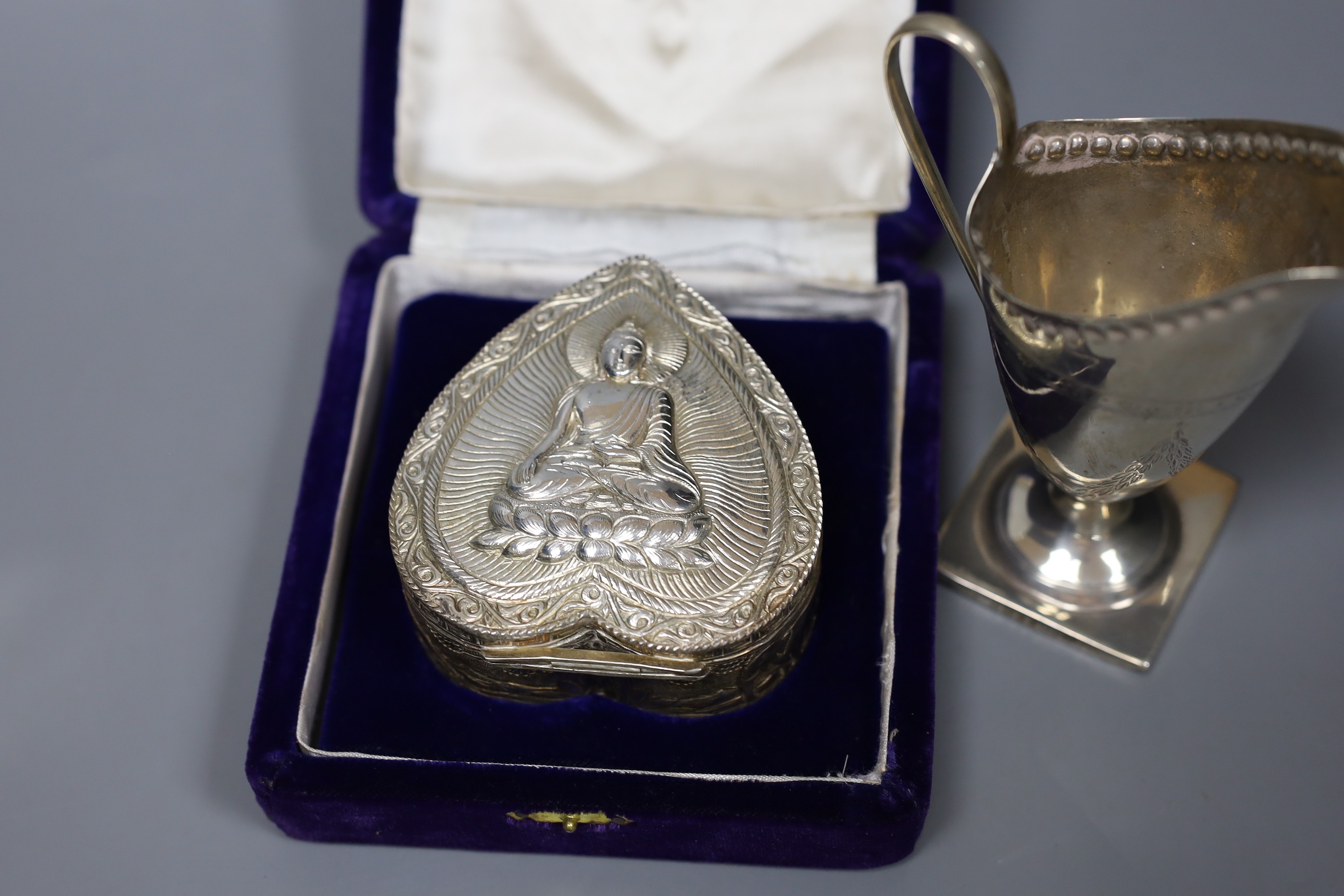 A Victorian engraved silver cream jug, Sheffield 1882, 13cm., engine-turned silver cigarette case, collection of pepper grinders, condiments, etc.